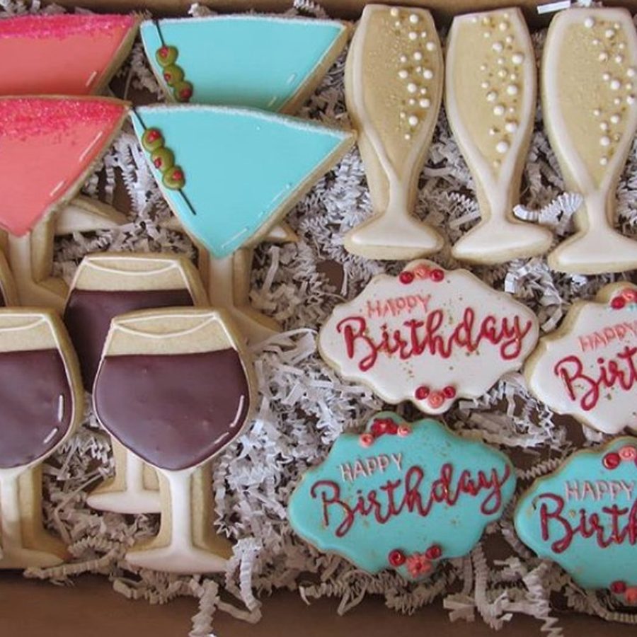 Birthday cookies with wine glasses and champagne flutes