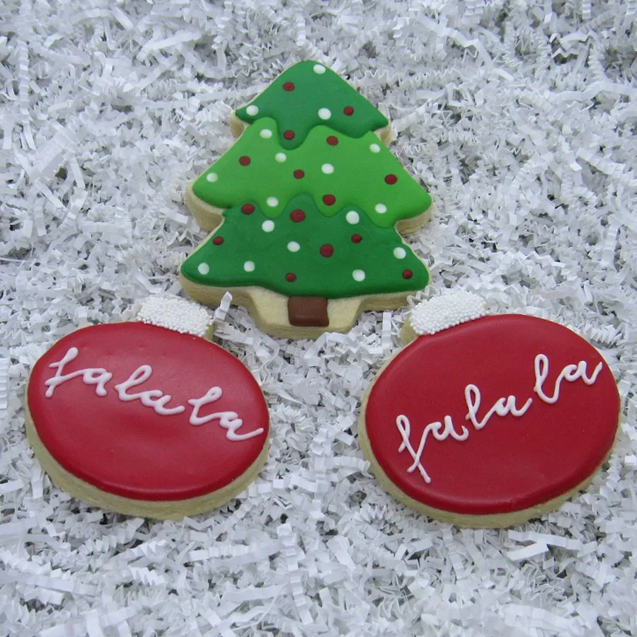 Christmas tree and red ornament cookies reading falala