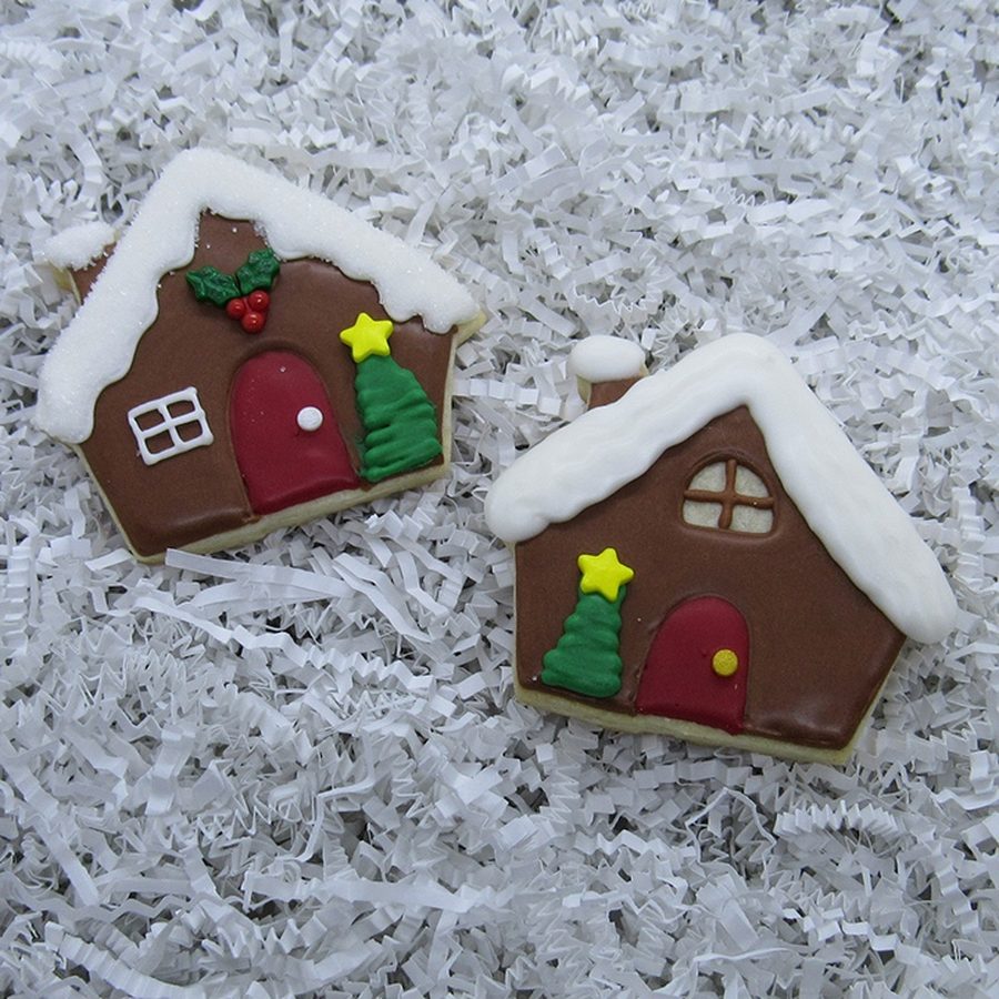 Gingerbread house cookies with piped snow