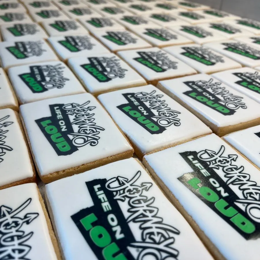 Rows of rectangle cookies printed with the Journeys logo