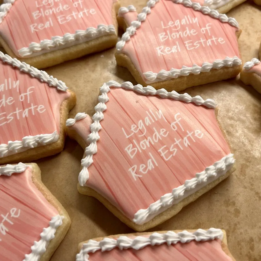 Pink house cookies piped with Legally Blonde of Real Estate