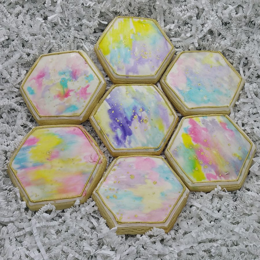 Hexagon cookies painted in soft watercolor with gold flecks